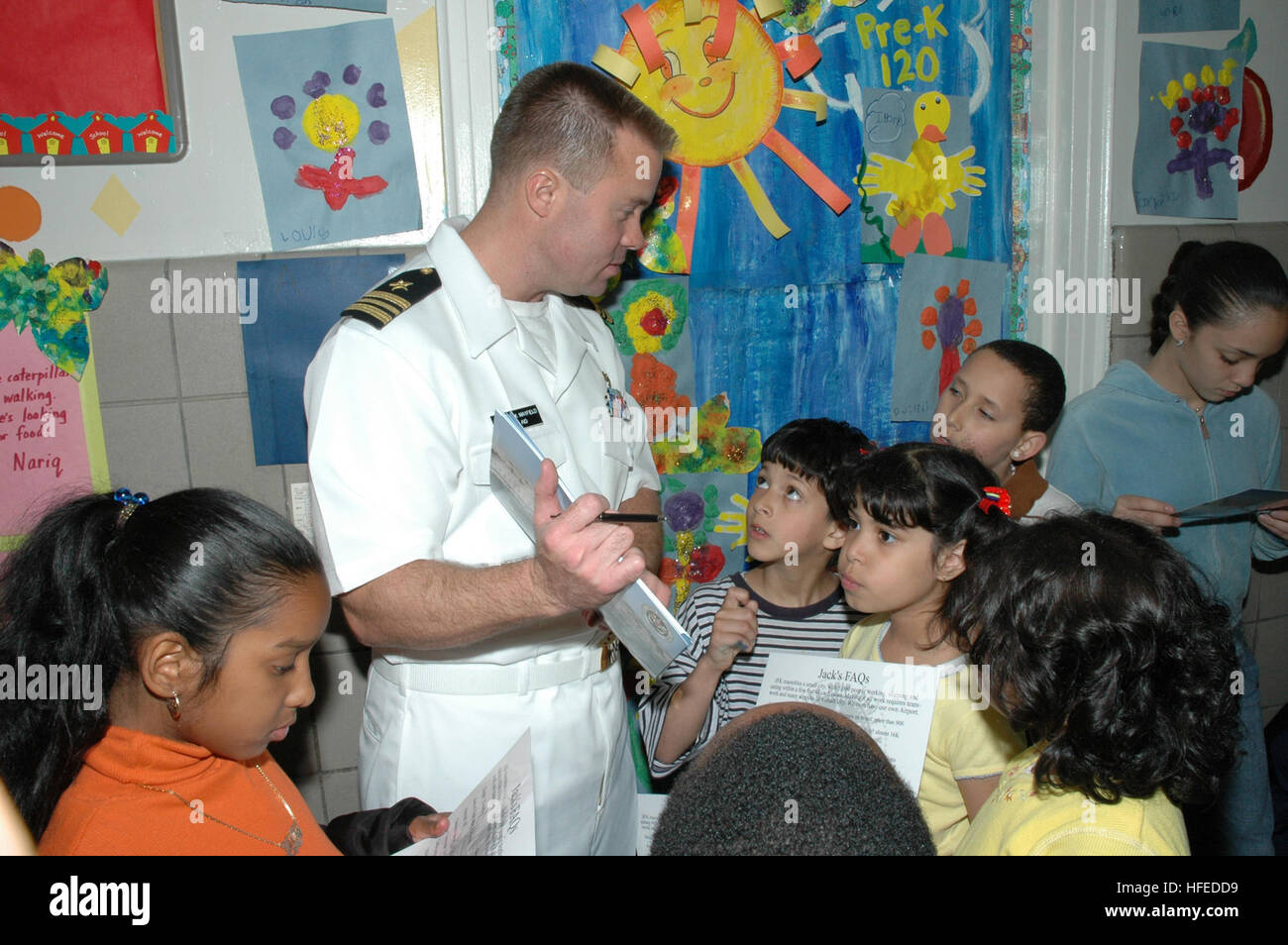 050526-N-1205W-001 New York City (May 26, 2005) Ð Lt. Cmdr. Chuck Mayfield speaks to children of the Jacob Blackwell After School Program in Queens, New York, during a community relations (COMREL) project as part of Fleet Week 2005. COMREL is a program for Sailor's and Marine's to get involved in the local community. Fleet Week allows the community to celebrate the sacrifices made by the U.S. Navy, Marine Corps, and Coast Guard by giving them the opportunity to visit the city and experience the ÒBig Apple'sÓ hospitality. U.S. Navy photo by PhotographerÕs Mate 2nd Class Regina Wiss (RELEASED) U Stock Photo