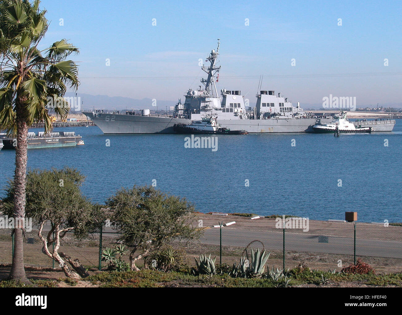 031215-N-1159B-001 Naval Weapons Station Seal Beach, Calif. (Dec. 15, 2003) -- The Arleigh Burke-class guided missile destroyer USS Fitzgerald (DDG 62) arrives at Naval Weapons Station (NWS) Seal Beach, to onload ammunitions.  Navy Weapons Station Seal Beach serves as the NavyÕs primary West Coast ordnance storage, loading and maintenance location.  An average of 80 vessels visit NWS Seal Beach each year to receive and offload various weapons, ammunition, and countermeasure devices.  U.S. Navy photo by Journalist 2nd Class Brian Brannon.  (RELEASED) US Navy 031215-N-1159B-001 The Arleigh Burke Stock Photo