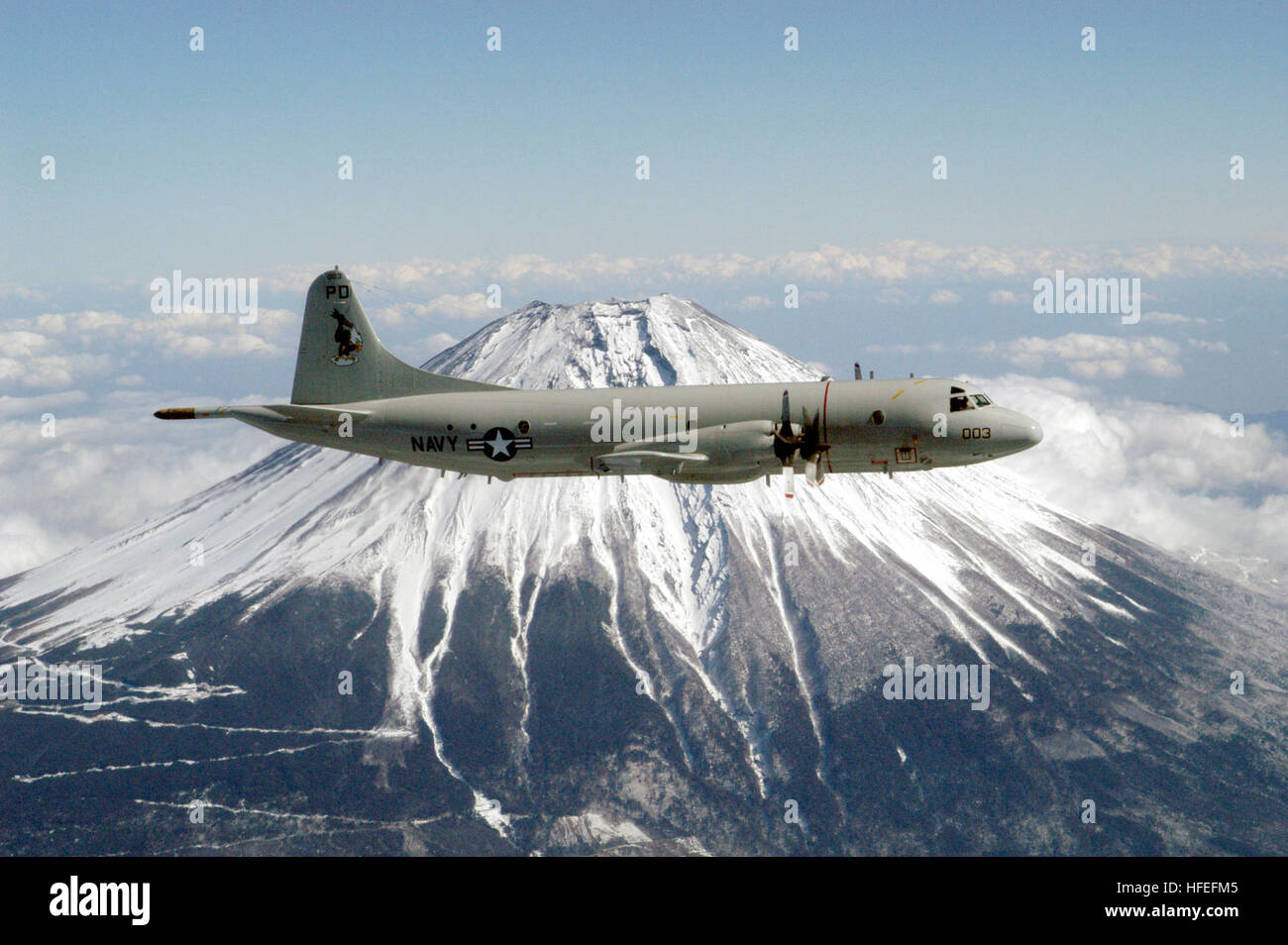 030213-N-9760B-001 Misawa, Japan (Feb. 13, 2003) -- A P-3C ÒOrionÓ assigned to the ÒGolden EaglesÓ of Patrol Squadron Nine (VP-9) circles Mt. Fuji.  VP-9 is forward deployed to Misawa, Japan.  U.S. Navy photo by PhotographerÕs Mate 2nd Class Elizabeth L. Burke.  (RELEASED) US Navy 030213-N-9760B-001 A P-3C %%5Eldquo,Orion%%5Erdquo, assigned to the %%5Eldquo,Golden Eagles%%5Erdquo, of Patrol Squadron Nine (VP-9) circles Mt. Fuji. VP-9 is forward deployed to Misawa, Japan Stock Photo