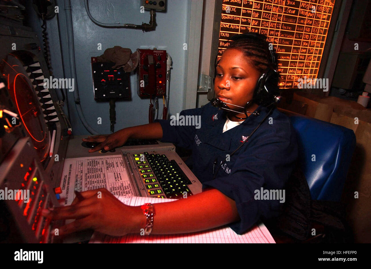 030214-N-1350S-011 The Mediterranean Sea (Feb. 14, 2003) -- Operations Specialist 3rd Class Natasha Whiteside tracks contacts in the Tactical Operations Plot room.  USS Harry S. Truman (CVN 75) and Carrier Airwing Three (CVW 3) are deployed on a regularly scheduled deployment in support of Operation Enduring Freedom.  U.S. Navy Photo by Photographer's Mate Airman Derrick M. Snyder.   (RELEASED) US Navy 030214-N-1350S-011 Operations Specialist 3rd Class Natasha Whiteside tracks contacts in the Tactical Operations Plot room Stock Photo