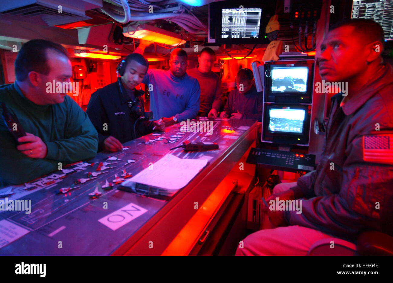 030228-N-3235P-503 Mediterranean Sea (Feb. 28, 2003) -- Aircraft Handler, Lt. Cmdr Richard D. Jones (right) directs flight deck control evolutions during night launch and recovery operations aboard the nuclear powered aircraft carrier USS Harry S. Truman (CVW 75). Truman and Carrier Air Wing Three (CVW 3) are on deployment in support of Operation Enduring Freedom. U. S. Navy photo by Photographer's Mate 1st Class Michael W. Pendergrass.  (RELEASED) US Navy 030228-N-3235P-503 Flight deck control on board USS Harry S. Truman CVN 75 Stock Photo