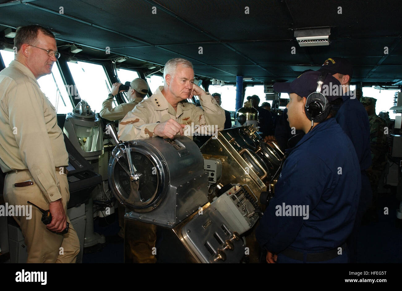030301-N-0120R-002 Arabian Gulf (Mar. 1, 2003) -- Vice Adm. Timothy Keating, Commander, U.S. Naval Force Central Command, tours the bridge of the aircraft carrier USS Kitty Hawk (CV 63) while meeting with Sailors aboard ship. Kitty Hawk and her embarked Carrier Air Wing Five (CVW-5) are conducting missions in support Operation Southern Watch and Enduring Freedom. Kitty Hawk and its embarked Carrier Air Wing Five (CVW-5) is the worldÕs only permanently forward-deployed aircraft carrier and operates out of Yokosuka, Japan.  U.S. Navy photo by PhotographerÕs Mate 3rd Class William H. Ramsey.  (RE Stock Photo