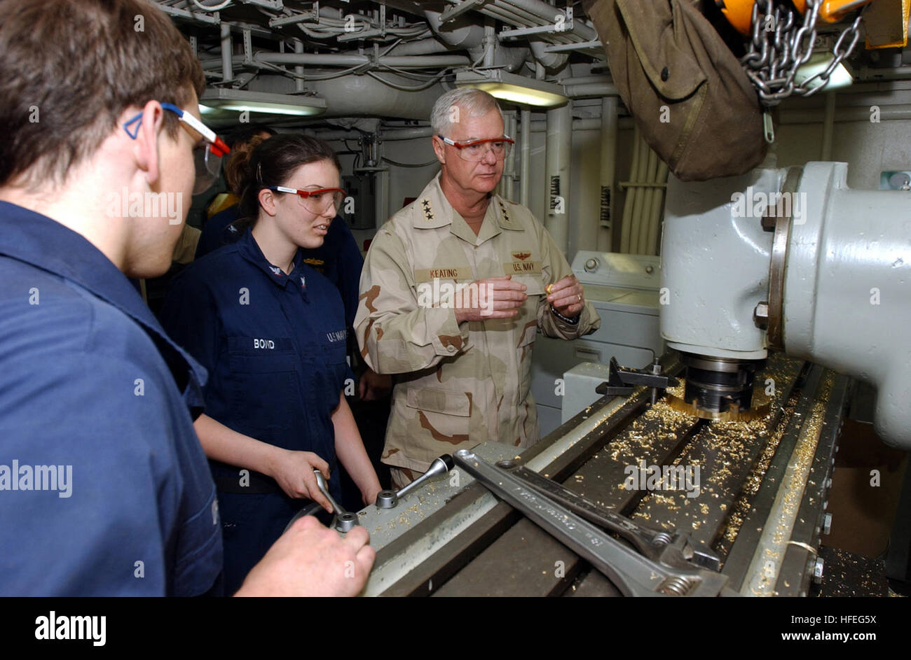 030301-N-0120R-012 Arabian Gulf (Mar. 1, 2003) -- Vice Adm. Timothy Keating, Commander, U.S. Naval Force Central Command, tours a machine shop space aboard the aircraft carrier USS Kitty Hawk (CV 63), during a visit with Sailors in the region. Kitty Hawk and Carrier Air Wing Five (CVW-5) are operating with coalition forces in the Arabian Gulf and is the worldÕs only permanently forward-deployed aircraft carrier operating out of Yokosuka, Japan.  U.S. Navy photo by PhotographerÕs Mate 3rd Class William H. Ramsey.  (RELEASED) US Navy 030301-N-0120R-012 Vadm. Keating visits USS Kitty Hawk Stock Photo