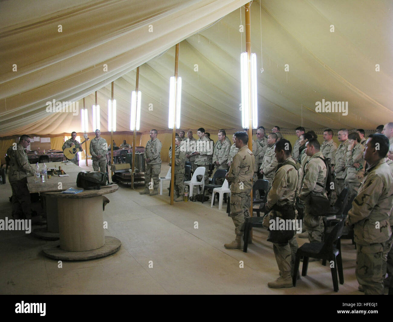 030316-N-0728B-001 Camp Luzon, Kuwait (Mar. 16, 2003) Ð The camp mess tent doubles as a chapel as members of Fleet Hospital Three pause from their daily schedules in support of Operation Enduring Freedom to gather for Sunday services.  The Pensacola, Fla-based Fleet Hospital deployed to the area of in support the global war on terrorism and to prepare for future contingencies as may be directed.  U.S. Navy photo by Chief Journalist Al Bloom.  (RELEASED) US Navy 030316-N-0728B-001 The camp mess tent doubles as a chapel as members of Fleet Hospital Three pause from their daily schedules in suppo Stock Photo