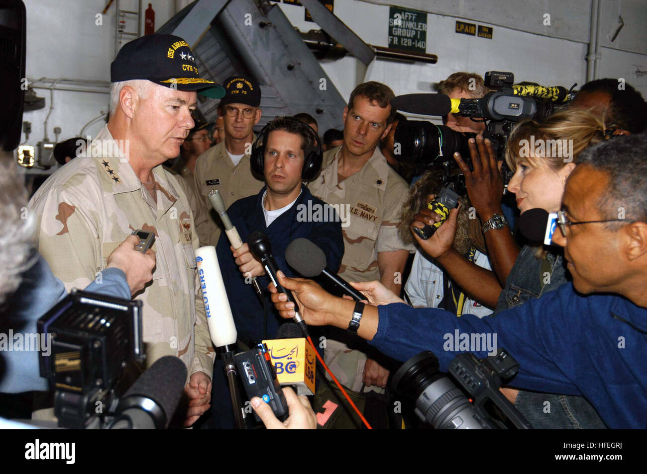 030319-N-9593M-022 The Arabian Gulf (Mar. 19, 2003) -- Vice Adm. Timothy J. Keating Commander, U.S. Naval Forces Central Command/ Commander Fifth Fleet takes questions from a pool of national and international print and broadcast media during a visit with crew aboard the aircraft carrier USS Abraham Lincoln (CVN 72).  Lincoln and Carrier Air Wing Fourteen (CVW-14) are conducting combat operations in support of Operation Southern Watch.  U.S. Navy photo by Photographer's Mate 3rd Class Philip A. McDaniel.  (RELEASED) US Navy 030319-N-9593M-022 Vice Adm. Timothy J. Keating Commander takes questi Stock Photo