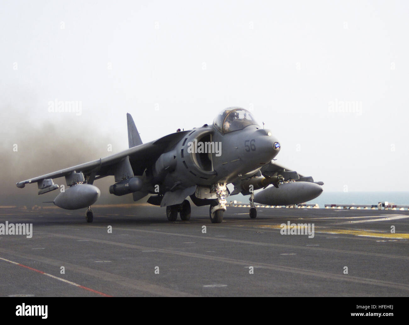 030325-N-7128D-002 The Arabian Gulf (Mar. 25, 2003) -- A Marine Corps AV-8B Harrier attack jet begins its takeoff roll on the flight deck of the USS Tarawa (LHA 1) on its way to provide close air support (CAS) for United States and Coaltion ground forces in southern Iraq in support of Operation Iraqi Freedom. Operation Iraqi Freedom is the multinational coalition effort to liberate the Iraqi people, eliminate Iraq's weapons of mass destruction and end the regime of Saddam Hussein.  U.S. Navy photo by Chief Photographer's Mate Tom Daily.  (RELEASED) US Navy 030325-N-7128D-002 A Marine Corps AV- Stock Photo