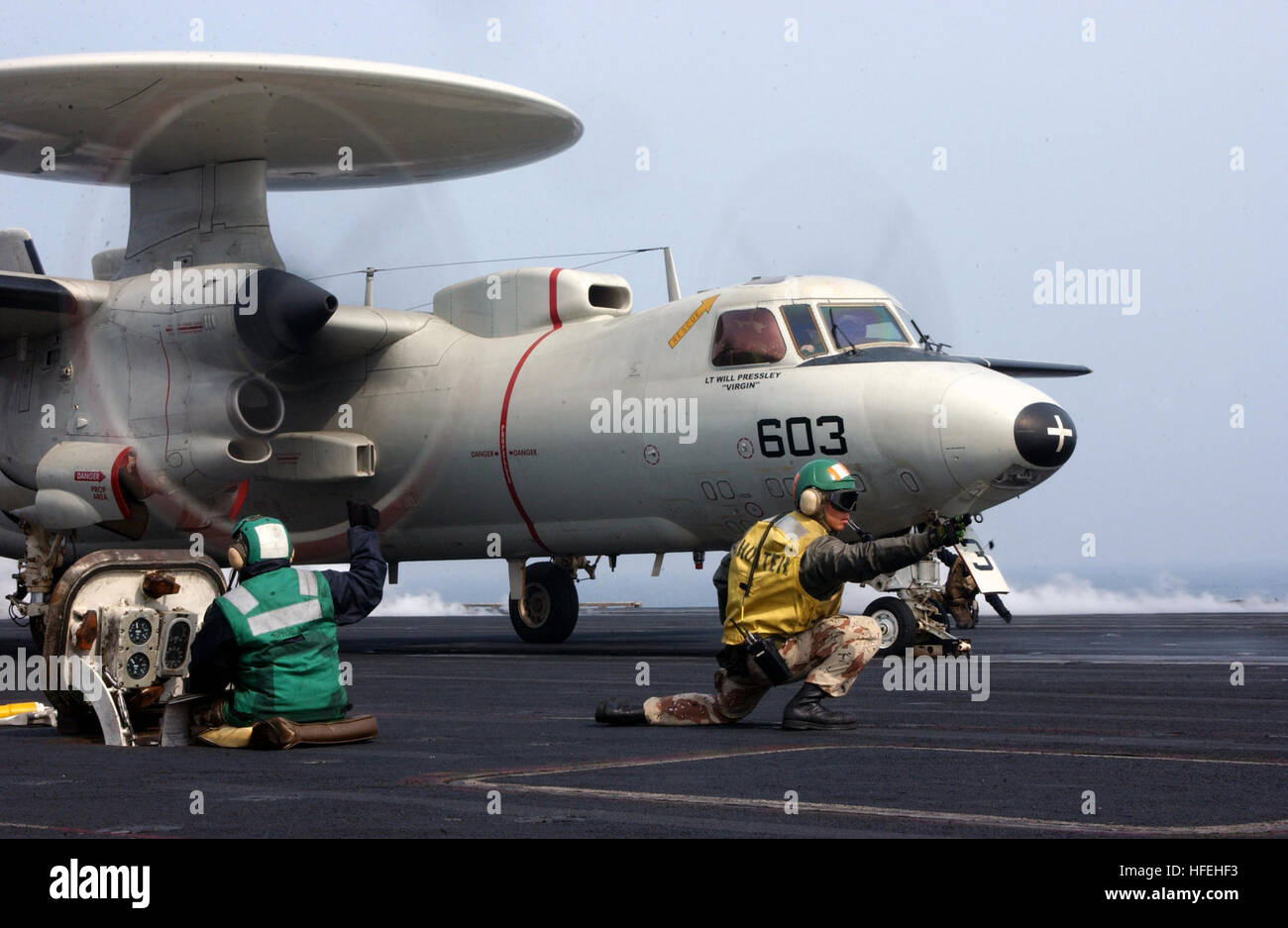 030326-N-0905V-003 Sea of Japan (Mar. 26, 2003) -- A 'Shooter' give the signal to launch an E-2C Hawkeye assigned to the 'Golden Hawks' of Carrier Airborne Early Warning Squadron One One Two (VAW-112) to prepare for launch from one of four steam driven catapults on the flight deck of USS Carl Vinson (CVN 70). Carl Vinson and Carrier Air Wing Eleven (CVW-11) are participating in Exercise Foal Eagle, an annual joint and combined field training exercise between the U.S. and Republic of Korea armed forces.  The exercise is designed to strengthen relationships and improve interoperability between b Stock Photo