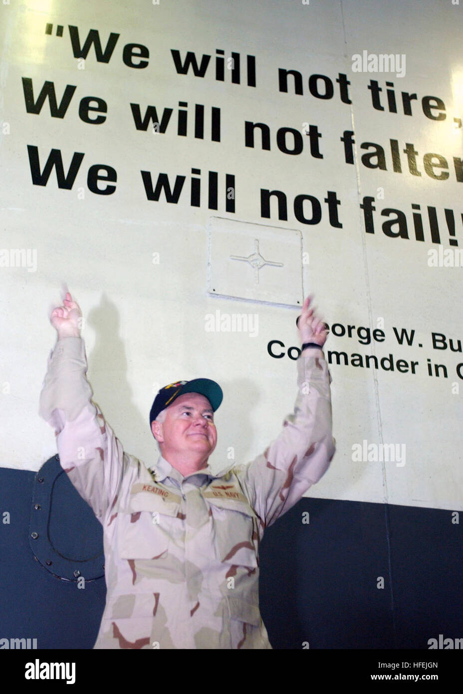 030415-N-8693O-002 The Arabian Gulf (Apr. 15, 2003)  -- Vice Adm. Timothy J. Keating, Commander, Fifth Fleet uses a quote painted on the shipÕs hanger bay divisional doors, ÒWe will not tire, we will not falter, we will not fail,Ó to represent the efforts of the shipÕs crew aboard USS Constellation (CV 64).  Constellation and Carrier Air Wing Two (CVW-2) are deployed in support of Operation Iraqi Freedom.  Operation Iraqi Freedom is the multinational coalition effort to liberate the Iraqi people, eliminate Iraq's weapons of mass destruction and end the regime of Saddam Hussein.  U.S. Navy phot Stock Photo
