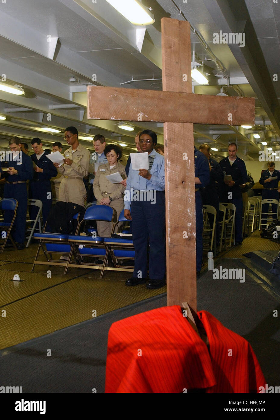 030418-N-4953E-012 Mediterranean Sea (Apr. 18, 2002) -- Sailors and Marines participate in a Good Friday Protestant Service in the Forecastle of USS Harry S. Truman (CVN 75).  Truman and her embarked Carrier Air Wing Three (CVW-3) are on deployment conducting combat missions in support of Operation Iraqi Freedom.  Operation Iraqi Freedom is the multi-national coalition effort to liberate the Iraqi people, eliminate Iraq's weapons of mass destruction, and end the regime of Saddam Hussein.  U.S. Navy photo by Photographer's Mate 3rd Class Danny Ewing Jr.  (RELEASED) US Navy 030418-N-4953E-012 Sa Stock Photo