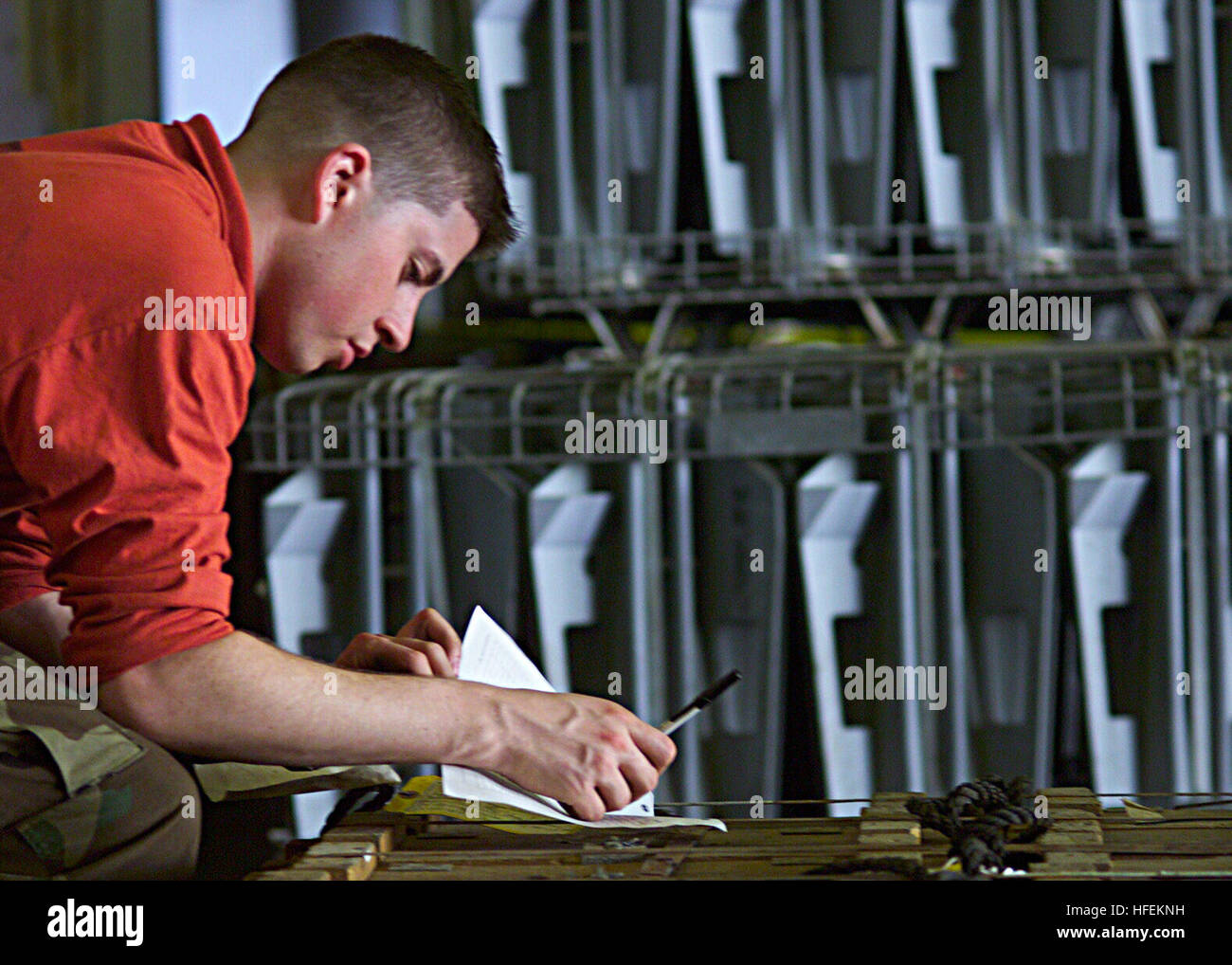 030429-N-2819P-023 The Arabian Gulf (Apr. 29, 2003) -- Aviation Ordnanceman Airman James Whitney inventories ammunition during an ammunition onload between the amphibious warfare ship USS Kearsarge (LHD 3) and the Ready Reserve Force Modular Cargo Delivery System ship SS Cape John (T-AK 5022).  The Kearsarge is deployed conducting combat missions in support of Operation Iraqi Freedom, the multi-national coalition effort to liberate the Iraqi people, eliminate Iraq's weapons of mass destruction, and end the regime of Saddam Hussein.  U.S. Navy photo by Photographer's Mate 3rd Class Jose E. Ponc Stock Photo