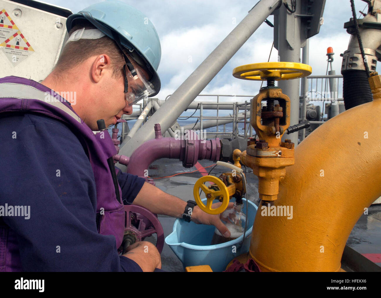 Gas Turbine System Technician collects diesel fuel marine samples ...