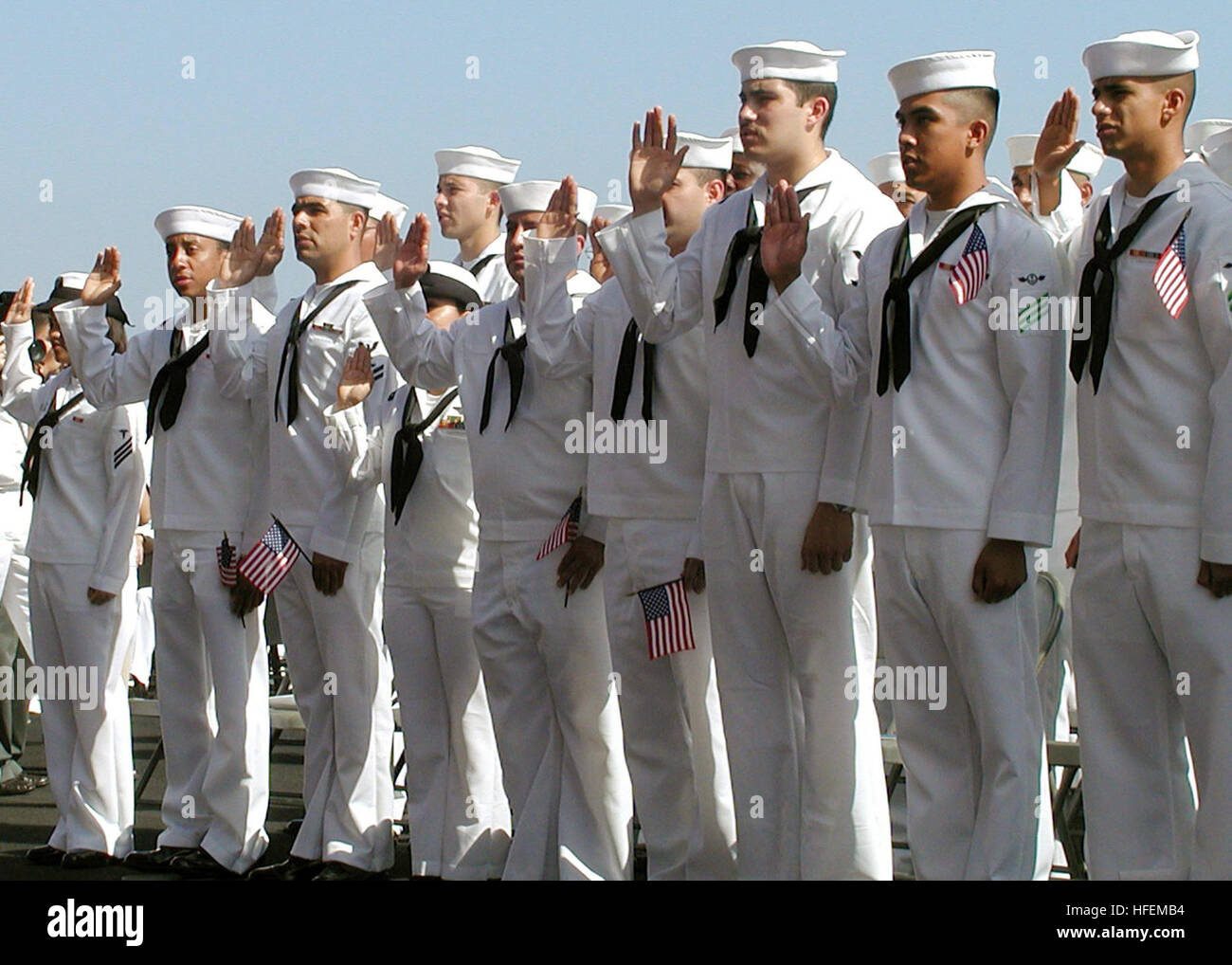 030702-N-9076B-001 Naval Air Station North Island, Calif. (Jul. 2, 2003) -- Sailors and U.S. Marines take the Oath of Citizenship held on the flight deck aboard USS Constellation (CV 64). Over 170 individuals from 35 different countries took the oath to become U.S. Citizens.   Constellation recently returned from a Western Pacific deployment in support of Operations Southern Watch, Enduring Freedom and Iraqi Freedom.  U.S. Navy photo by Chief PhotographerÕs Mate Donald Bray.  (RELEASED) US Navy 030702-N-9076B-001 Sailors and U.S. Marines take the Oath of Citizenship held on the flight deck abo Stock Photo