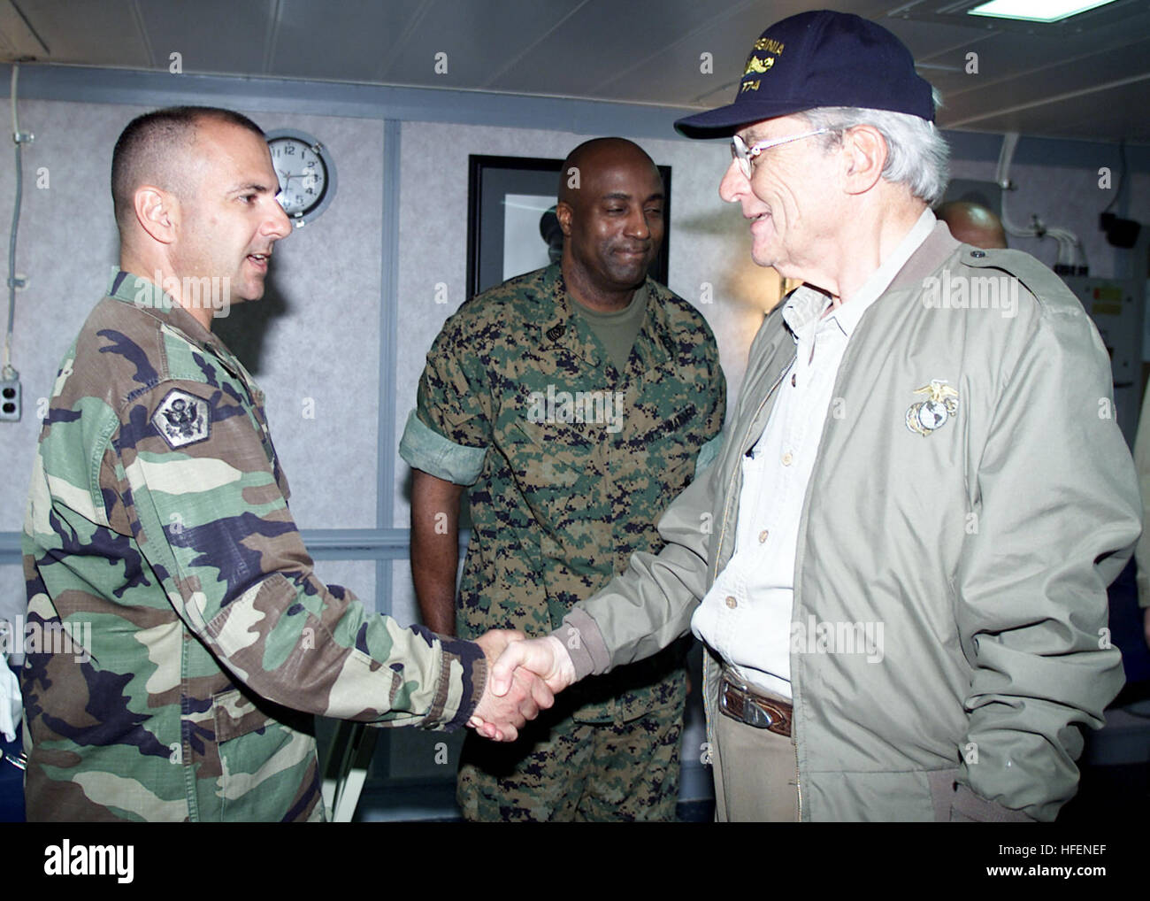 030827-N-2954M-114 Atlantic Ocean (Aug. 27, 2003) -- Senate Armed Services Committee Chairman Sen. John Warner (R-Va.), right, greets Army Sgt. Maj. Lawrence Lane, assigned to Joint Task Force Liberia. Warner visited the ship to meet with Sailors and Marines of the Iwo Jima Amphibious Ready Group (ARG), currently on station off the coast of Liberia in support of peace-keeping missions. During his stay, Warner dined with Sailors and Marines and held an all-hands call in the ship's hangar bay.  U.S. Navy photo by Photographer's Mate 3rd Class Julianne Metzger.  (RELEASED) US Navy 030827-N-2954M- Stock Photo