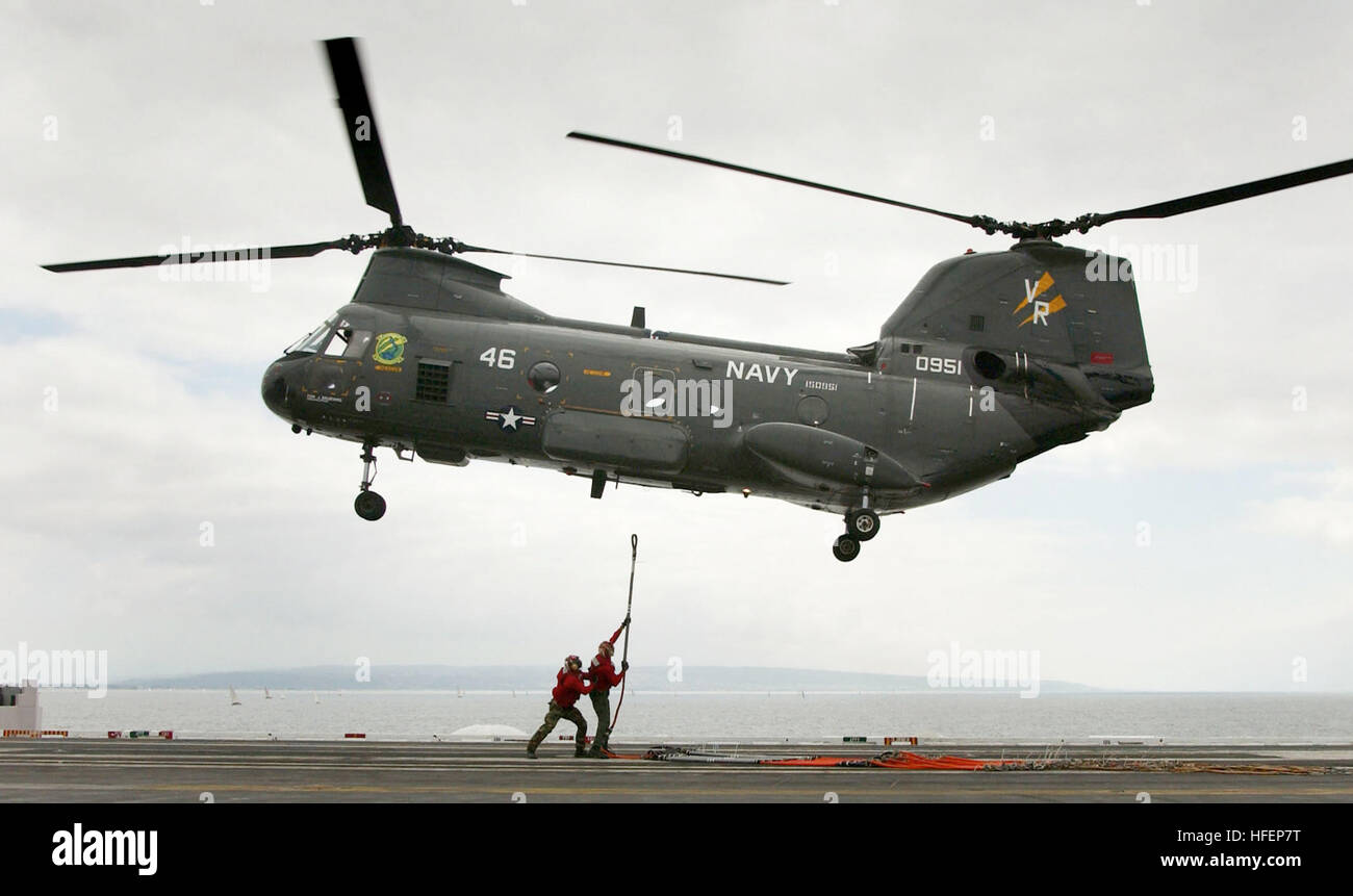 031003-N-6213R-356  Pacific Ocean (Oct. 3, 2003) -- Aviation Ordnancemen attach a cargo pennant to a CH-46 Sea Knight, assigned to the 'Gunbearers' of Helicopter Combat Support Squadron Eleven (HC-11), on the flight deck of USS John C. Stennis (CVN 74).  Stennis is at sea in the Southern California operating area.  U.S. Navy photo by Photographer's Mate Airman Mark J. Rebilas.  (RELEASED) US Navy 031003-N-6213R-356 Aviation Ordnancemen attach a cargo pendant to a CH-46 Sea Knight, assigned to the Gunbearers of Helicopter Combat Support Squadron Eleven (HC-11), on the flight deck of USS John C. Stock Photo