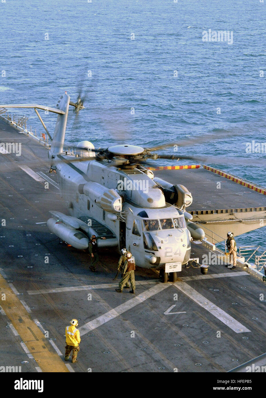 031006-N-6895M-002 Arabian Sea (Oct. 6, 2003) -- A CH-53 'Sea Stallion' assigned to the ÒRidge RunnersÓ of Marine Medium Helicopter Squadron One Six Three (HMM-163) lifts off from the flight deck of USS Peleliu (LHA 5) during daily flight operations. The helicopter squadron is embarked aboard Peleliu while underway in the Arabian Sea. U.S. Navy photo by PhotographerÕs Mate 2nd Class James K. McNeil.  (RELEASED) US Navy 031006-N-6895M-002 A CH-53 Sea Stallion lifts off from the flight deck of USS Peleliu (LHA 5) Stock Photo