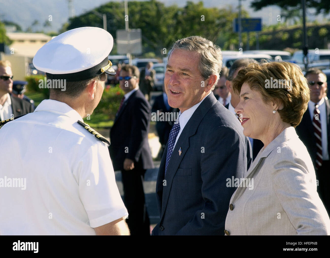 031023-N-7590D-079 Naval Station Pearl Harbor, Hawaii (Oct. 23, 2003) -- President George W. Bush and First Lady Laura Bush are greeted by Captain Ronald R. Cox, Commander Naval Station Pearl Harbor Hawaii, during the Presidents visit with veterans and service members aboard the station. President Bush stopped in Hawaii on his way back from the Asia-Pacific Economic Cooperation Forum in Thailand, the Philippines, Japan, Singapore, and Bali where he discussed security and the continued fight against terrorism.   Asia- Pacific Economic Cooperation, or APEC, is the premier forum for facilitating  Stock Photo