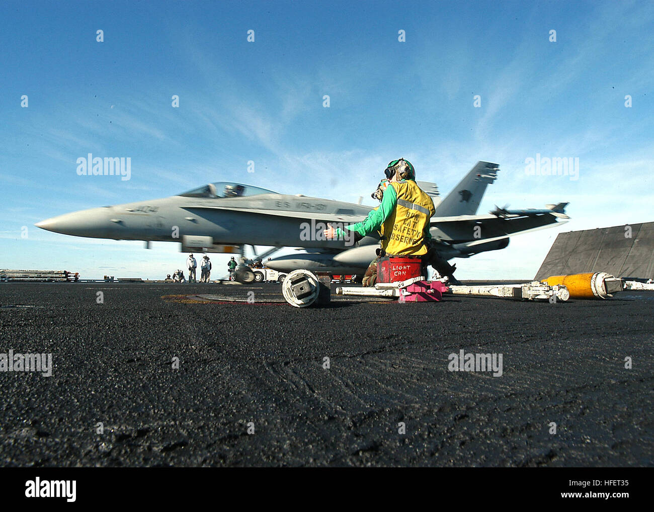 Catapult Safe A bow catapult safety observer signals F/A-18 Hornet readiness for ...