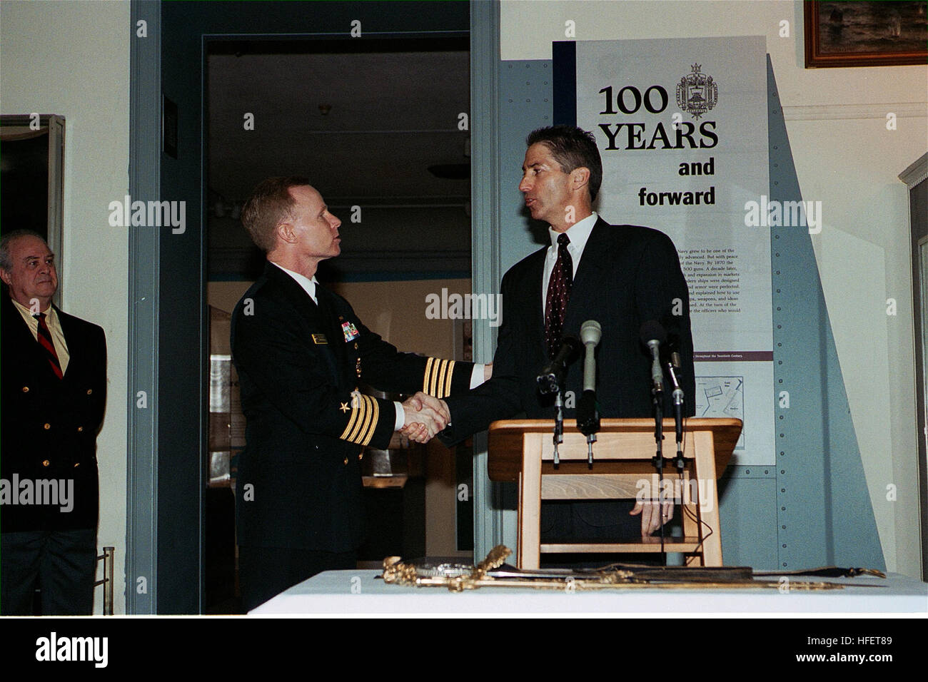 040112-N-0000X-002 Annapolis, Md. (Jan. 12, 2004) -- U.S. Naval Academy Commandant of Midshipmen Capt. Joe Leidig, left, shakes hands with Jeffrey A. Lampinski, Special Agent in Charge of the Philadelphia Division of the FBI during a ceremony to welcome the Worden Sword back to the Naval Academy,  missing since 1931. The Tiffany sword was originally presented to Rear Adm. John L. Worden by the state of New York for his command of USS Monitor in its famous battle with CSS Virginia in Hampton Roads, Va., and March 9, 1862.  Rear Adm. Worden also served as the seventh Superintendent of the U.S. N Stock Photo