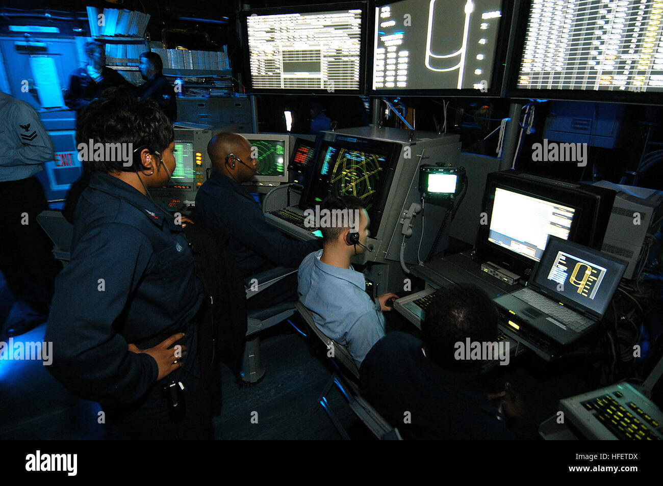 031217-N-6278K-001  Atlantic Ocean (Dec. 17, 2003) -- Air Traffic Controllers man the Carrier Air Traffic Control Center (CATCC) during flight operations aboard USS George Washington (CVN 73).  The Norfolk, Va.-based nuclear powered aircraft carrier is conducting Composite Training Unit Exercise (COMPTUEX) in the Atlantic Ocean, during preparations for an upcoming deployment.  U.S. Navy photo by PhotographerÕs Mate Airman Joan Kretschmer.  (RELEASED) US Navy 031217-N-6278K-001 Air Traffic Controllers man the Carrier Air Traffic Control Center (CATCC) during flight operations aboard USS George  Stock Photo