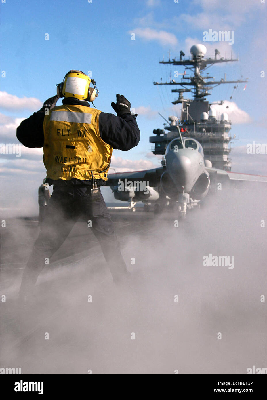 040121-N-6278K-001 Atlantic Ocean (Jan. 21, 2004) Ð Aviation BoatswainÕs Mate Airman Jorge Font from San Sebastian, Puerto Rico, signals to an EA-6B Prowler, assigned to the ÒPatriotsÕ of  Electronic Attack Squadron One Four Zero (VAQ-140) onto one of four steam-powered  catapults aboard USS George Washington (CVN 73).  The Norfolk, Va.-based nuclear powered aircraft carrier recently departed on a scheduled deployment.  U.S. Navy photo by PhotographerÕs Mate Airman Joan Kretschmer.  (RELEASED) US Navy 040121-N-6278K-001 Aviation Boatswain%%5Ersquo,s Mate Airman Jorge Font from San Sebastian, P Stock Photo