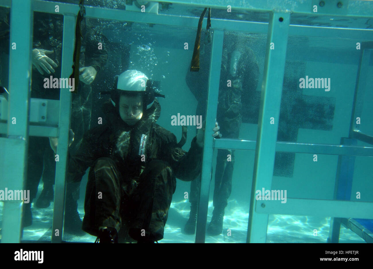 A student trains in water survival and emergency egress techniques at ...
