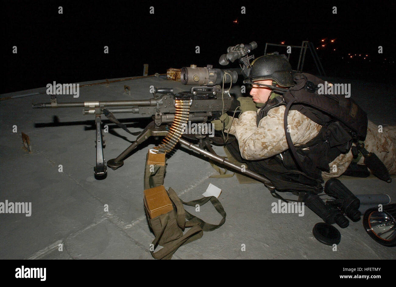 040130-N-0331L-008 Arabian Gulf (Jan. 30, 2004)- Pfc. Justin McLachlan assigned to the 1st Fleet Anti-terrorism Security Team (FAST) 6th Platoon, scans the horizon for the enemy during a training exercise in the region. The guided missile cruiser USS Philippine Sea (CG 58) and 1st FAST 6th Platoon and are forward deployed to the Arabian Sea in support of Operations Iraqi Freedom and Enduring Freedom. U.S. Navy photo by Photographer's Mate 2nd Class Jeffrey Lehrberg. (RELEASED) US Navy 040130-N-0331L-008 Pfc. Justin McLachlan assigned to the 1st Fleet Anti-terrorism Security Team (FAST) 6th Pla Stock Photo