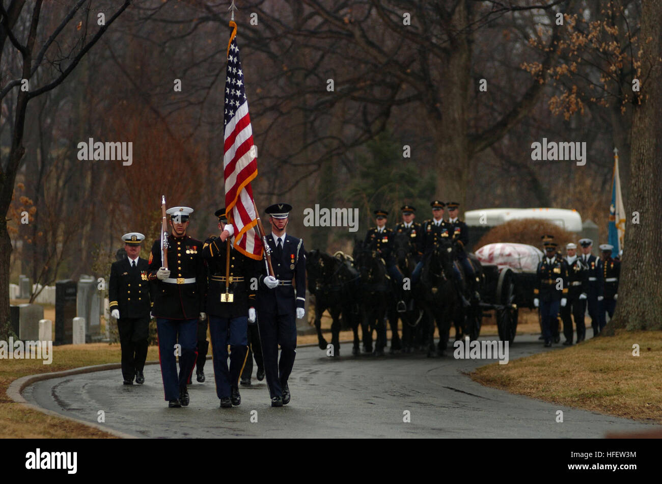 040224-N-6213R-009 Arlington, Va. (Feb. 20, 2004) Ð Members of the U.S. ArmyÕs 3rd Infantry ÒOld GuardÓ caisson platoon, parade the black flag draped casket of Adm. Thomas H. Moorer, during a full military honors burial at Arlington National Cemetery. Adm. Moorer is a graduate of the Naval Academy class of1933 and went on to served as the Chief of Naval Operations from 1967-1970, whereupon he was appointed Chairman of the Joint Chiefs of Staff, a post he held until his retirement in 1974. A former naval aviator, Moorer earned many medals and honors during his career, including the Department o Stock Photo