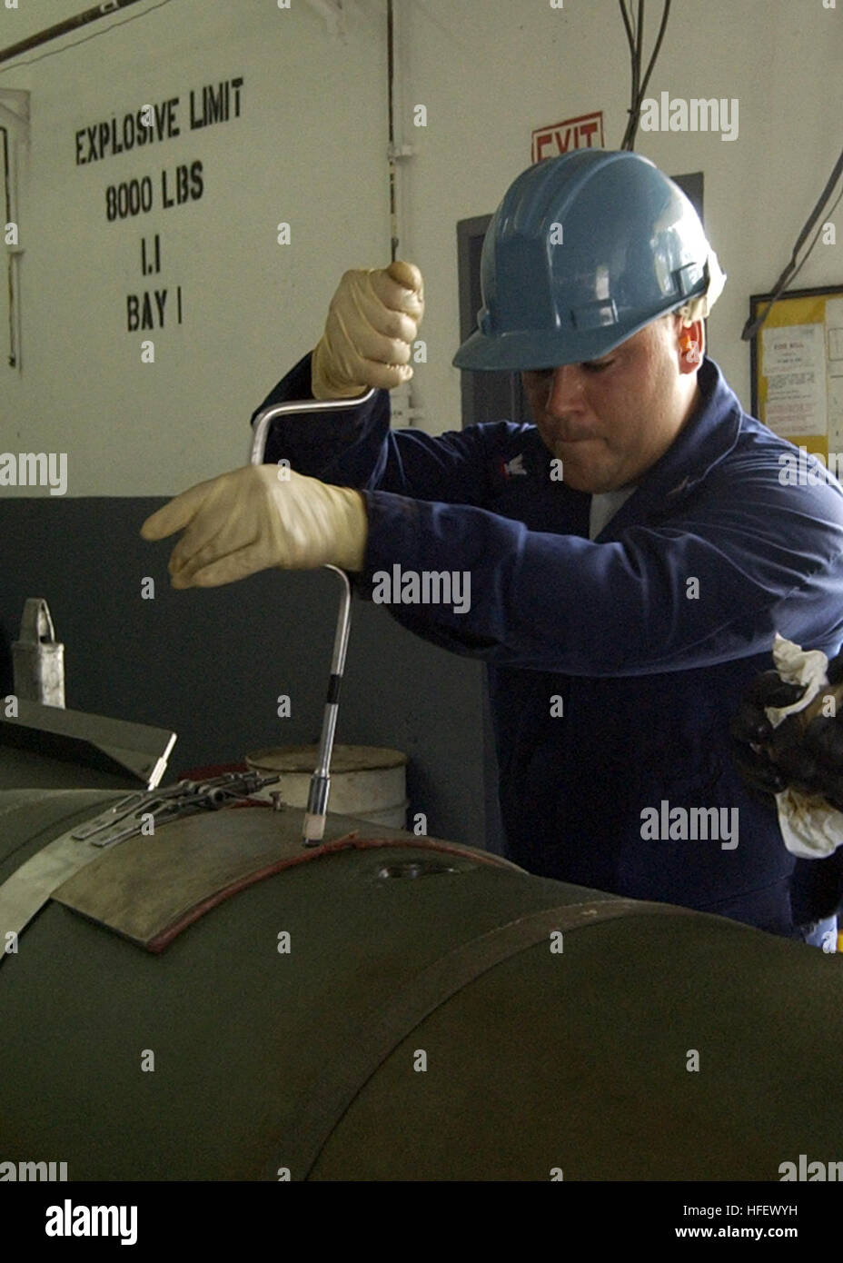 040323-N-7293M-123 Santa Rita, Guam (Mar. 23, 2004) - Mineman 3rd Class J. C. Drouin removes an access panel on a Mark 65 Quick Strike Mine. Petty Officer Drouin, a Naval Reservist assigned to Naval Reserve Mobile Mine Assembly Unit Ten (MOMAU-10) in El Paso, Texas, is performing his annual drill at MOMAU-8, located aboard the U.S. Naval Magazine, Guam. U.S. Navy photo by Photographer's Mate 2nd Class Nathanael T. Miller. (RELEASED) US Navy 040323-N-7293M-123 Mineman 3rd Class J. C. Drouin removes an access panel on a Mark 65 Quick Strike Mine Stock Photo