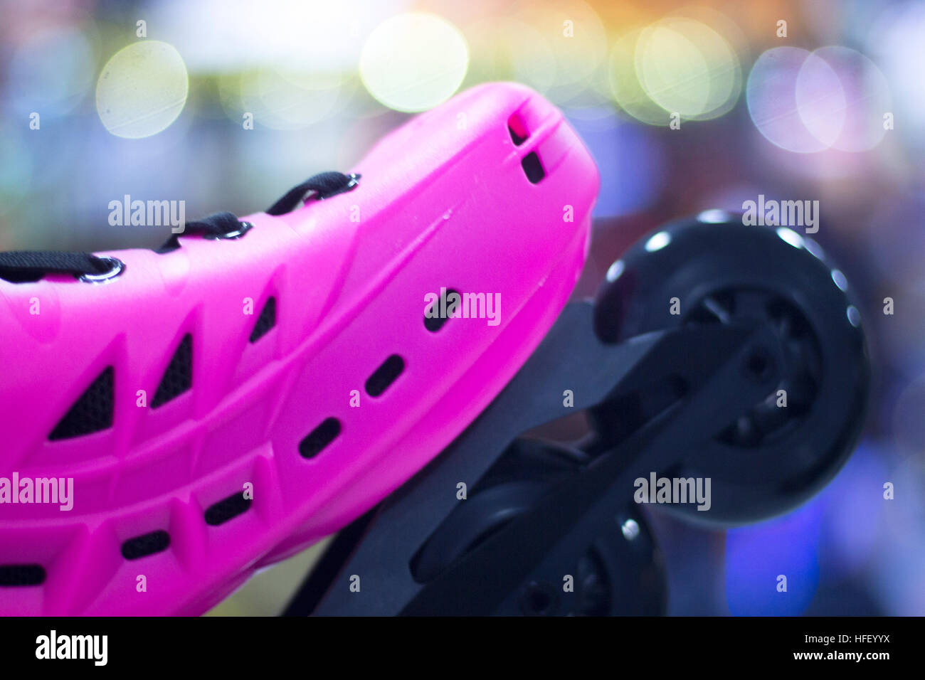 Freestyle pink ladies inline skates boots and wheels in retail store