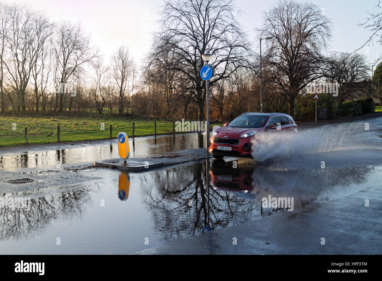 uk weather flooding car red through flood Stock Photo