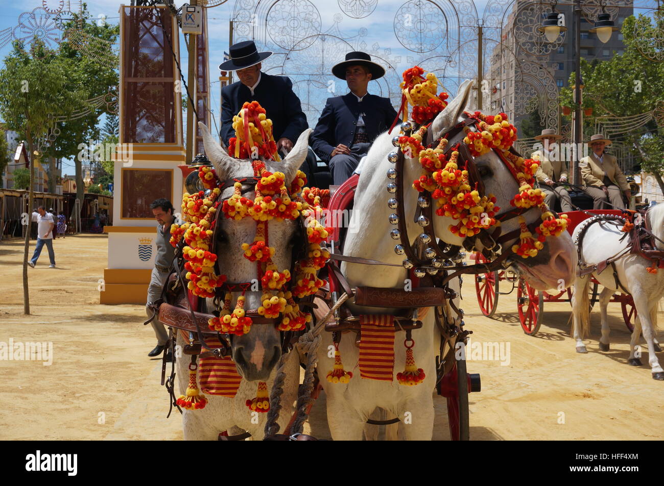 Andalucian equestrian art  during the Feria in Jerez de la Frontera.Art of horse carriage and traditional carts. -  07/05/2013  -  Spain / Andalusia / Jerez de la Frontera  -  Andalucian equestrian art  during the Feria in Jerez de la Frontera.Art of horse carriage and traditional carts. The andalucian equestrian art is famous all over the world thanks to the Royal Andalucian School of Equestrian Art which is a training centre for the best andalucian horsemen and a conservatory of the  equestrian heritage and traditions of the region. The art of dressage and hotse carriages are represented eve Stock Photo