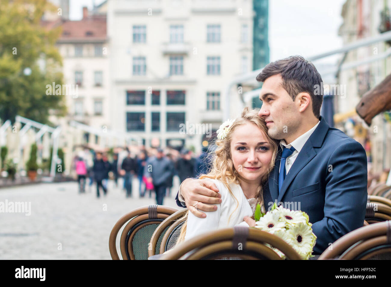 Happy newlyweds sitting table in hi-res stock photography and images ...