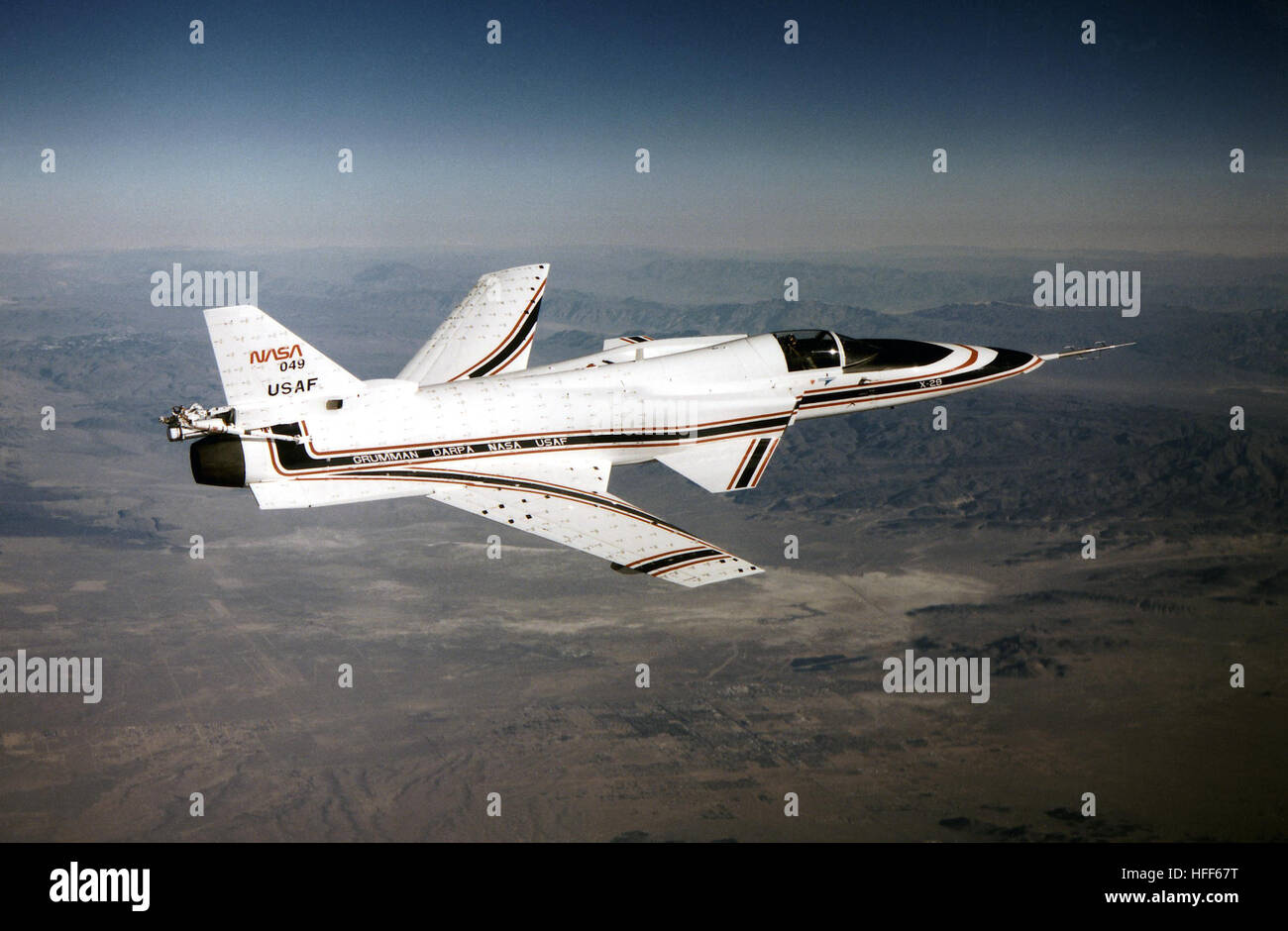 EC90-039-4 The No. 2 X-29 technology demonstrator aircraft is seen here during a 1990 test flight. At this angle, the aircraft&amp;rsquo;s unique forward-swept wing design is clearly visible. The X-29 was flown by NASA's Ames-Dryden Flight Research Facility later redesignated the Dryden Flight Research Center, Edwards, California, in a joint NASA-Defense Advanced Research Projects Agency-Air Force program to investigate the unique design's high-angle-of-attack characteristics and its military utility. Tufts -- small strips of cloth attached to the surface of the aircraft to visually study the  Stock Photo