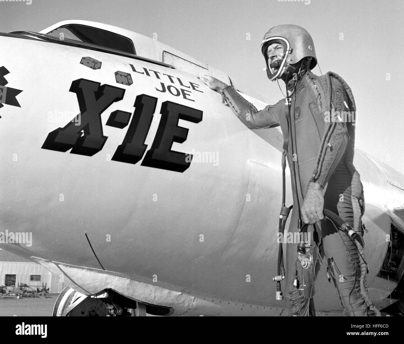 A 1950s photograph features test pilot Joe Walker alongside the Bell X-1E aircraft, highlighting the aircraft's role in high-speed research and its contribution to breaking the sound barrier. Stock Photo