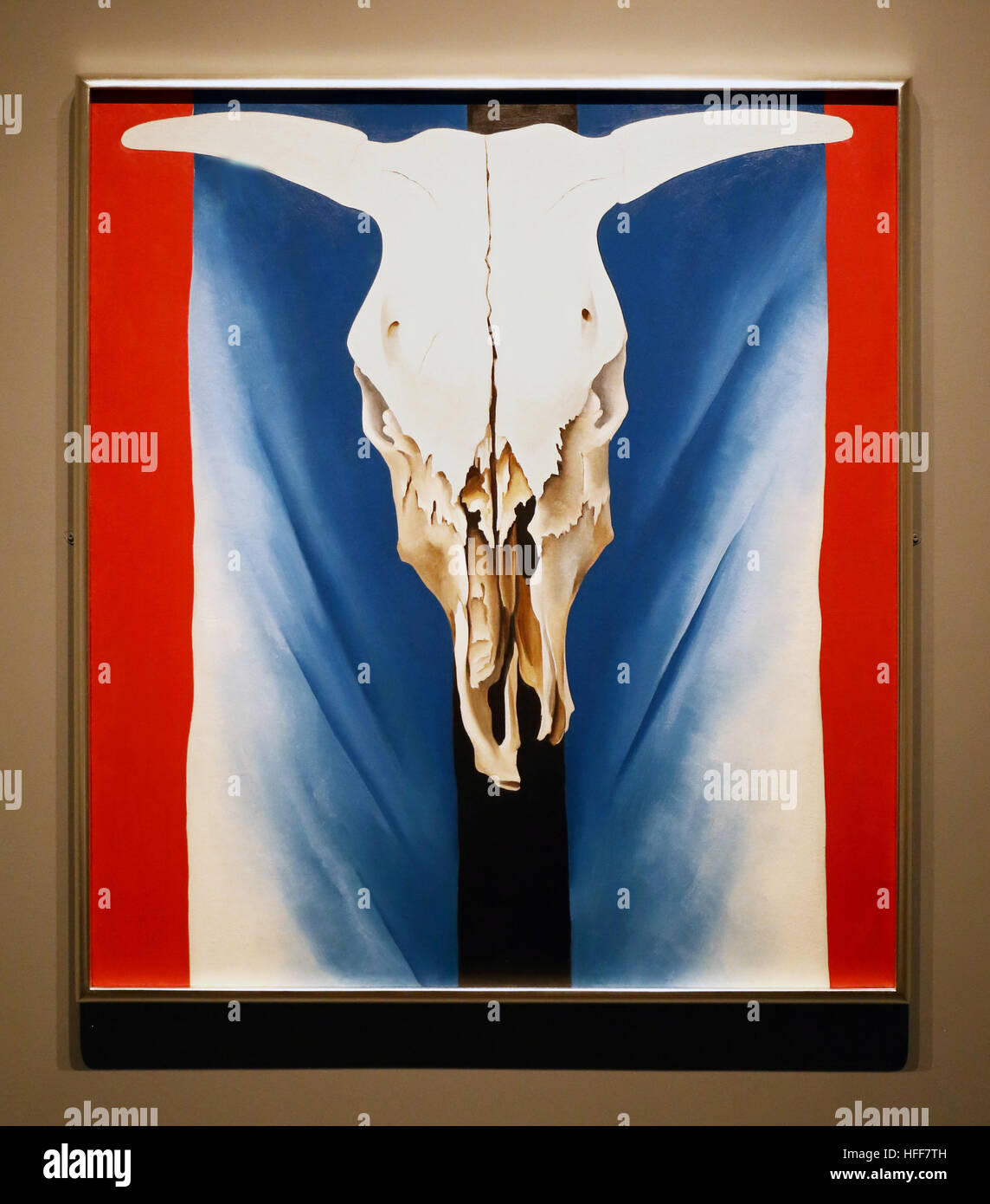 Oil painting of 'Cow's Skull: Red, White, and Blue'  by American artist Georgia O'Keeffe hanging at the Metropolitan Museum of Art in New York City. Stock Photo
