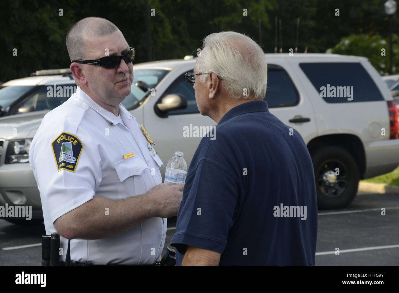 Policeman talks to a senior citizen, Stock Photo