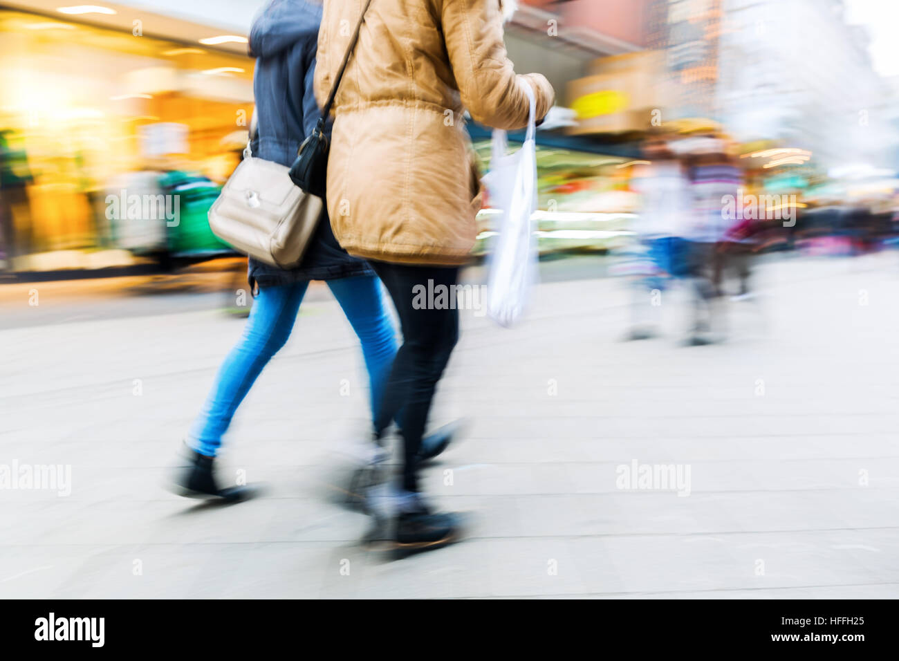 people walking on a shopping street with camera made motion blur Stock ...