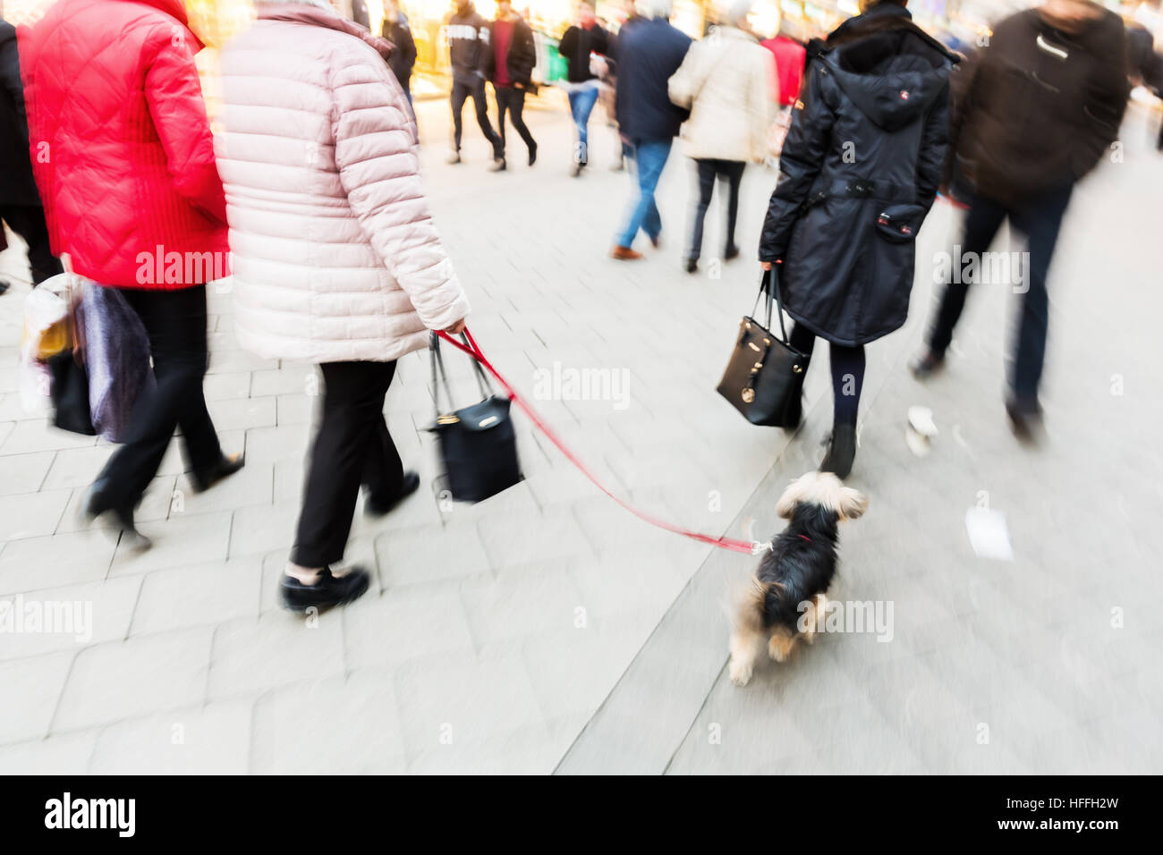 people walking on a shopping street with camera made motion blur Stock Photo