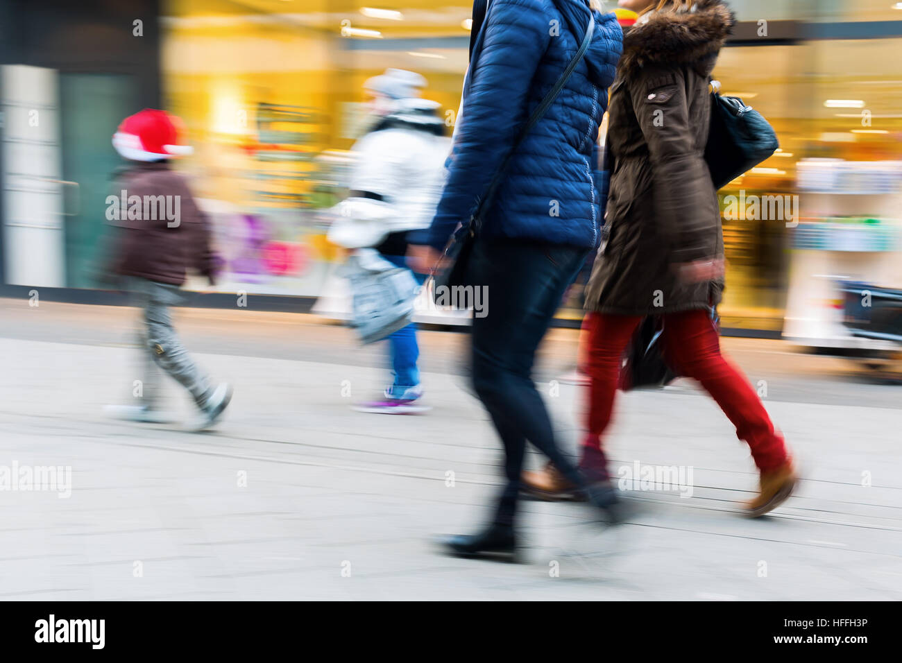 people walking on a shopping street with camera made motion blur Stock ...