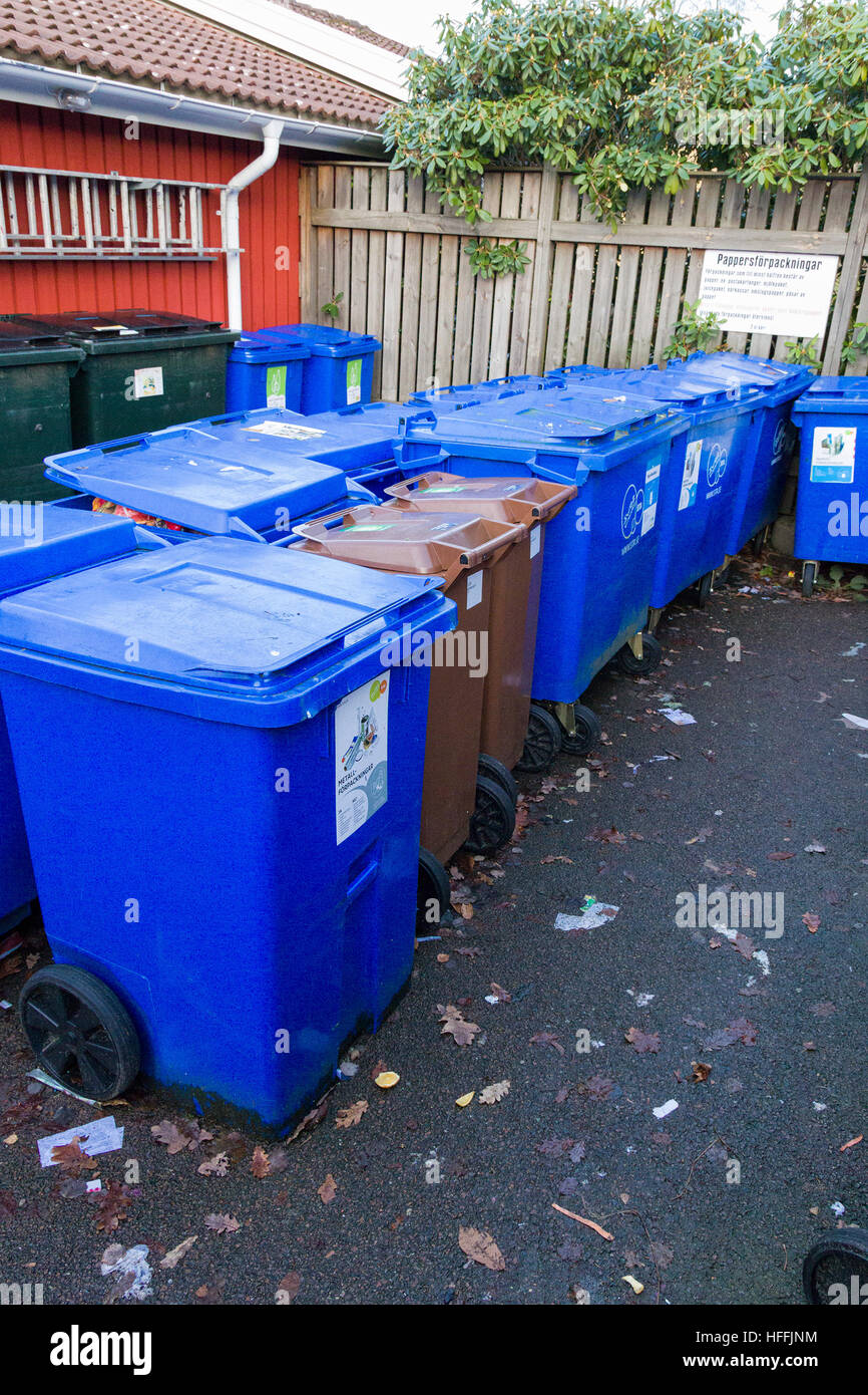 Rows of waste containers or wheelie bins in residential garbage or rubbish collection area  Model Release: No.  Property Release: No. Stock Photo