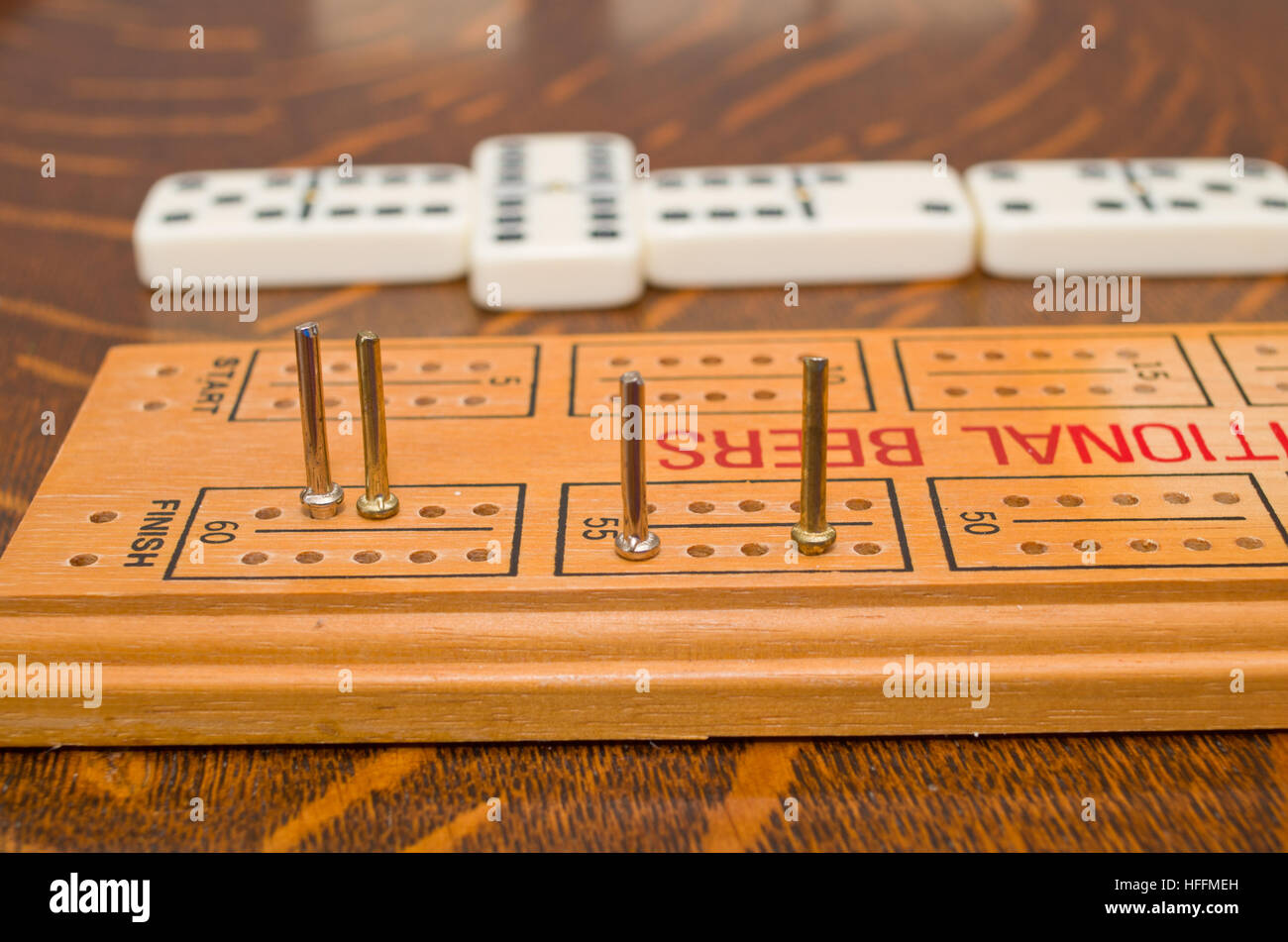 Scoring Dominoes Using Cribbage Board Or Peg Board Stock Photo 