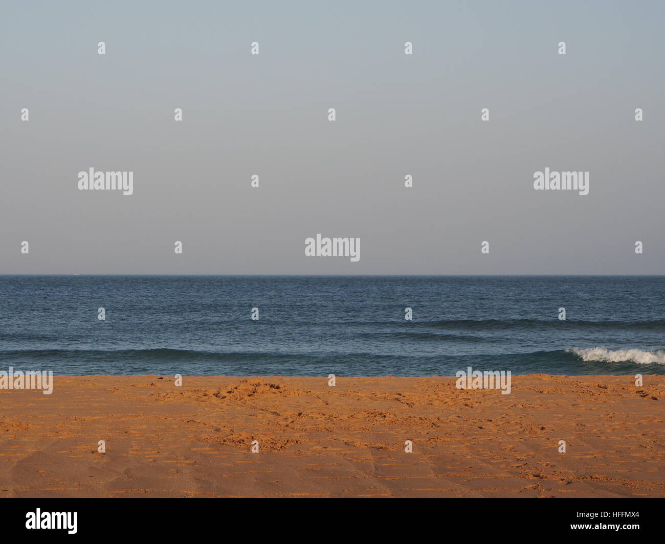 Sky, sea, surf, sand Stock Photo