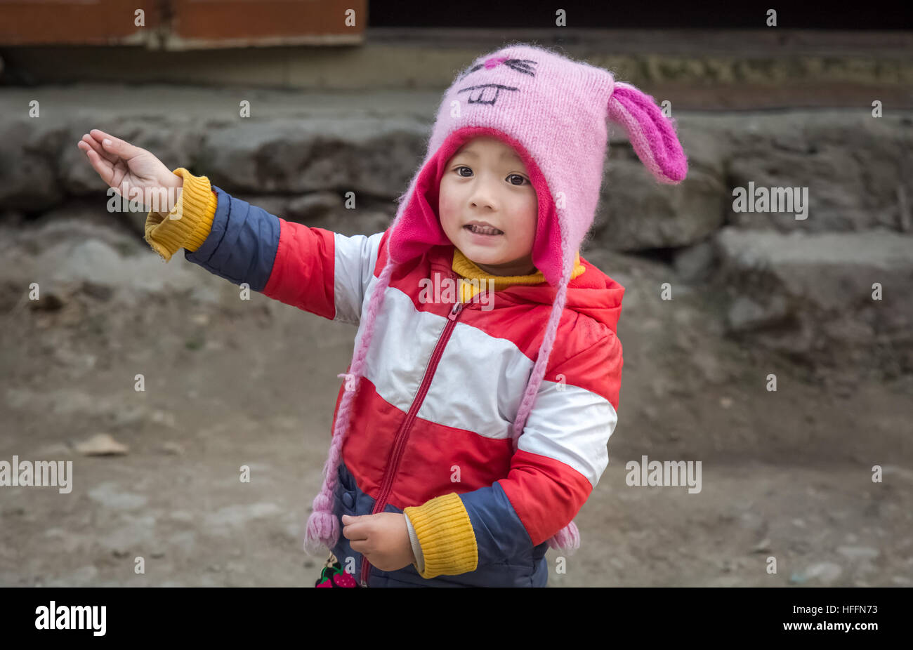 Cute expressive Indian kid in winter wear at Lachung, Sikkim, India. Stock Photo