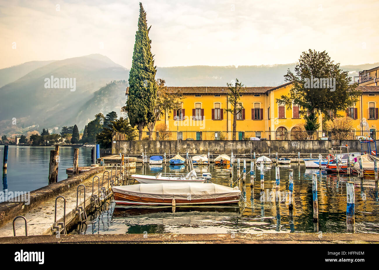italian lakeside village iseo dock boats Stock Photo