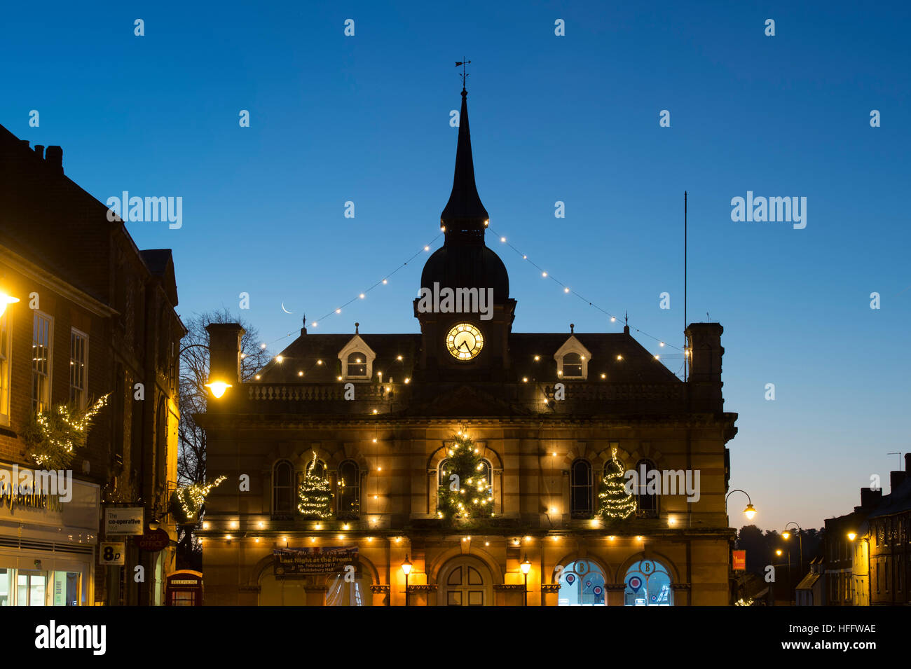 The Old Town Hall with Christmas lights before sunrise, Market Square, Towcester, Northamptonshire, England Stock Photo