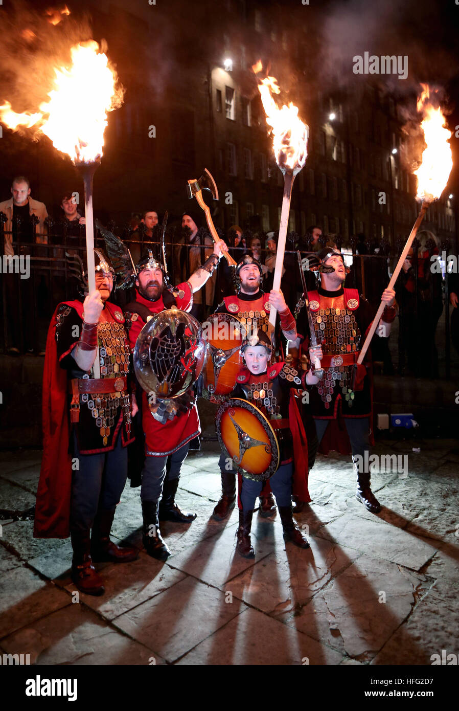 The opening event of Edinburghs Hogmanay celebrations begins with the annual Torchlight Procession, as thousands of torch carriers led by Shetlands Up Helly Aa Vikings (pictured) and the massed pipes and drums march through the city centre to a spectacular fireworks finale ahead of the Hogmanay celebrations for the New Year. Stock Photo
