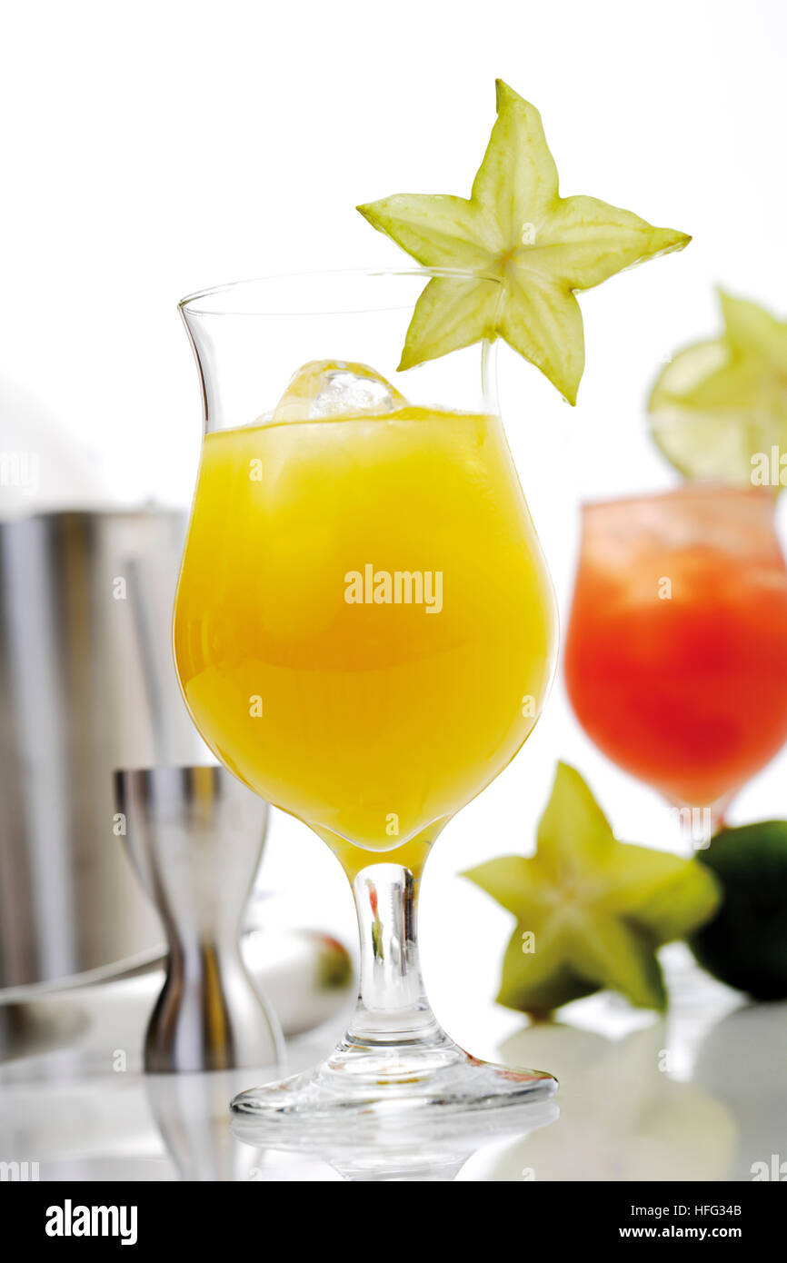 Two cocktails orange and strawberry daiquiris garnished with