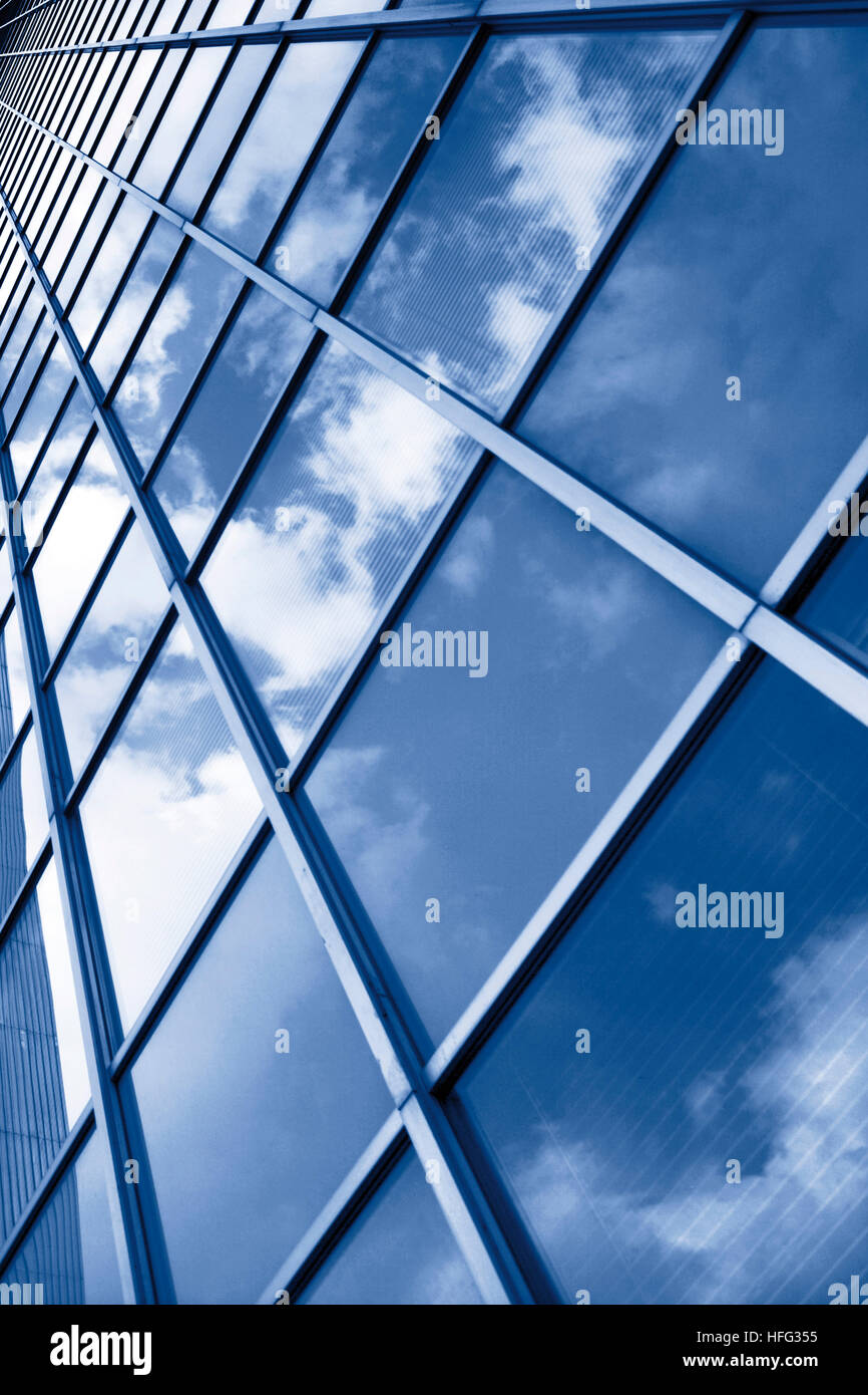Clouds reflected in the glass facade of an office tower Stock Photo - Alamy