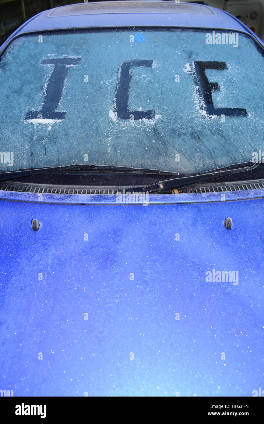 roadside car covered in thick winter ice uk Stock Photo