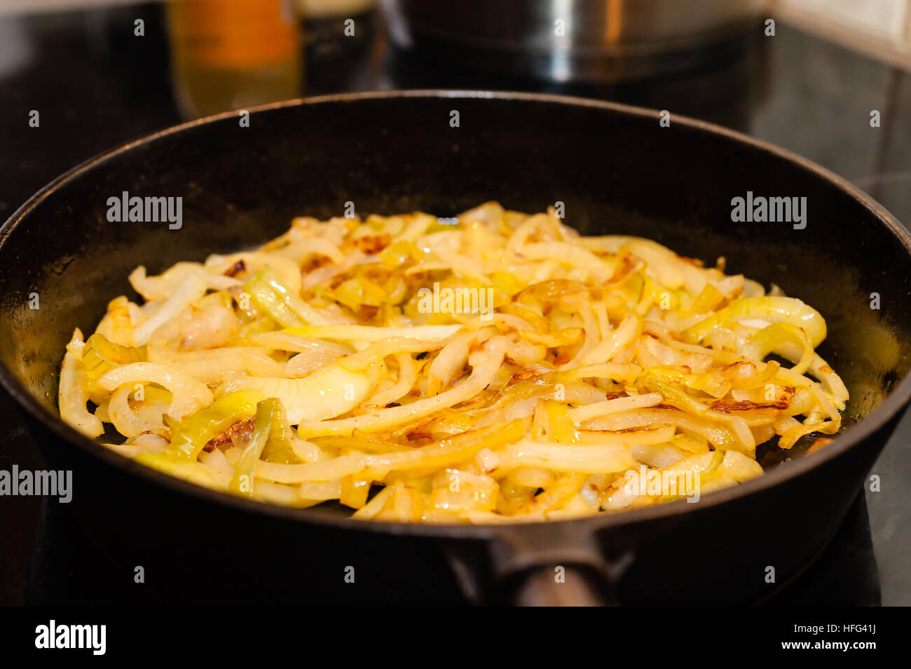 Golden brown sauteed onions in a cast iron skillet Stock Photo Alamy